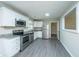 Updated kitchen with stainless steel appliances, granite countertops, sleek cabinets, and durable flooring at 2003 Savage Rd, Charleston, SC 29407