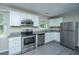 A well-equipped kitchen featuring stainless steel appliances, granite countertops, and white cabinets at 2003 Savage Rd, Charleston, SC 29407