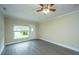 Inviting living room with stylish flooring, neutral walls, large windows, and a ceiling fan at 2003 Savage Rd, Charleston, SC 29407