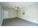 Open living room with durable flooring, neutral walls, a window, a back door, and ceiling fan at 2003 Savage Rd, Charleston, SC 29407
