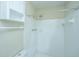 Tiled shower stall features a rain shower head and convenient wall-mounted storage and towel rack at 2003 Savage Rd, Charleston, SC 29407