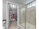 Modern bathroom featuring a glass shower and walk-in closet with organized storage at 202 Center Hill Ct, Summerville, SC 29485