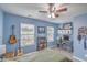 Comfortable bedroom with natural light, ceiling fan, and workstation at 202 Center Hill Ct, Summerville, SC 29485