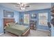 Comfortable bedroom with natural light, ceiling fan, and bookcase at 202 Center Hill Ct, Summerville, SC 29485