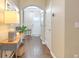 Warm and inviting foyer featuring hardwood floors, an arched doorway, and a view of the front door at 202 Center Hill Ct, Summerville, SC 29485