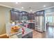 Modern kitchen featuring dark cabinets, granite countertops, stainless steel appliances, and hardwood floors at 202 Center Hill Ct, Summerville, SC 29485