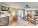 Spacious living room showing the dining and kitchen areas featuring a fireplace and comfortable seating at 202 Center Hill Ct, Summerville, SC 29485