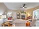 Cozy living room featuring a fireplace, ceiling fan, and comfortable seating area at 202 Center Hill Ct, Summerville, SC 29485