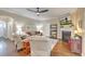 Bright living room with fireplace, ceiling fan, and neutral toned comfortable seating at 202 Center Hill Ct, Summerville, SC 29485