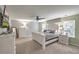 Bright main bedroom with large windows, a ceiling fan, and neutral decor at 202 Center Hill Ct, Summerville, SC 29485