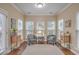 Charming sunroom with lots of natural light, neutral paint, and hardwood floors at 202 Center Hill Ct, Summerville, SC 29485