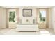 Beautiful bedroom with natural light, a plush bed, matching nightstands, and stylish decor at 207 Agrarian Ave, Summerville, SC 29485