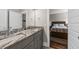 Bathroom with granite countertops, dual sinks, cabinet storage, and a view into the bedroom at 2208 Primus Rd, Mount Pleasant, SC 29466