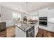 Open-concept kitchen with granite counters, stainless appliances, and a view into the living area at 2208 Primus Rd, Mount Pleasant, SC 29466