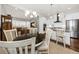Open-concept space with dining and kitchen area next to a living room and lots of natural light at 2208 Primus Rd, Mount Pleasant, SC 29466