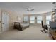 Bright bedroom featuring neutral walls, three windows, and carpet flooring at 2225 Black Oak Ct, Mount Pleasant, SC 29466