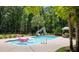 Private backyard oasis with a swimming pool, fun floats, sun umbrella, and lounge chairs, perfect for relaxation at 2225 Black Oak Ct, Mount Pleasant, SC 29466