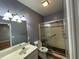 Bathroom featuring shower and tub with glass doors, vanity with sink, and neutral decor at 236 Chamblee Rd, Walterboro, SC 29488