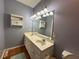 Bathroom featuring a double sink vanity, modern lighting, and a neutral color scheme at 236 Chamblee Rd, Walterboro, SC 29488