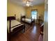 Bedroom with hardwood floors, ceiling fan, and two beds at 236 Chamblee Rd, Walterboro, SC 29488
