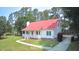 Charming one-story home with a red roof, covered porch, and well-manicured lawn at 236 Chamblee Rd, Walterboro, SC 29488