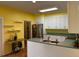 Bright kitchen featuring white cabinets, stainless steel appliances, and an eat-in countertop at 236 Chamblee Rd, Walterboro, SC 29488
