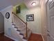 Inviting foyer with staircase, light walls, and hardwood floors at 236 Chamblee Rd, Walterboro, SC 29488