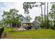 Beautifully landscaped backyard featuring a gazebo and well-maintained lawn at 259 Camber Rd, Huger, SC 29450