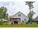 Spacious backyard featuring a gazebo, outdoor seating, and a well-maintained lawn, ideal for gatherings at 259 Camber Rd, Huger, SC 29450