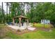 Landscaped backyard with a gazebo and hot tub at 259 Camber Rd, Huger, SC 29450