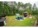 Backyard features a firepit, gazebo, and grilling area at 259 Camber Rd, Huger, SC 29450