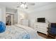 Relaxing bedroom featuring a ceiling fan, dressers, and a cozy chair, all decorated with nautical decor at 259 Camber Rd, Huger, SC 29450