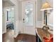 Inviting entryway featuring hardwood floors, stylish decor, and a glimpse into the adjacent living space at 259 Camber Rd, Huger, SC 29450