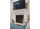 Close-up of the fireplace featuring stone detailing, a mantel with decor, and adjacent furnishings at 259 Camber Rd, Huger, SC 29450