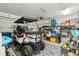 Well-lit garage featuring a custom golf cart and ample storage space at 259 Camber Rd, Huger, SC 29450