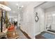 Elegant hallway with hardwood floors, decorative accents, and access to various rooms in the house at 259 Camber Rd, Huger, SC 29450