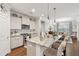 Bright kitchen features a center island with seating, stainless appliances, and an open layout to the dining area at 259 Camber Rd, Huger, SC 29450