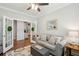 Inviting living room with a gray couch, decorative pillows, and open French doors leading to the kitchen at 259 Camber Rd, Huger, SC 29450