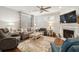 Cozy living room with fireplace, plush seating, and large windows offering ample natural light at 259 Camber Rd, Huger, SC 29450