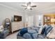 Stylish main bedroom featuring a bed with a paisley coverlet, a TV, and elegant furnishings and decor at 259 Camber Rd, Huger, SC 29450