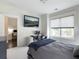 Bedroom featuring a wall-mounted TV and adjacent study space at 2769 Rivertowne Pkwy, Mount Pleasant, SC 29466