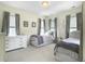 Light-filled bedroom featuring two beds and a dresser at 2769 Rivertowne Pkwy, Mount Pleasant, SC 29466