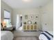 Sunlit bedroom featuring two twin beds and a desk at 2769 Rivertowne Pkwy, Mount Pleasant, SC 29466