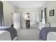 Bright bedroom featuring two beds, open closet space, and neutral decor at 2769 Rivertowne Pkwy, Mount Pleasant, SC 29466