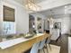 Open concept dining room and kitchen with hardwood floors and modern decor at 2769 Rivertowne Pkwy, Mount Pleasant, SC 29466
