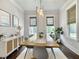 Elegant dining room featuring modern decor, large windows, and a stylish chandelier at 2769 Rivertowne Pkwy, Mount Pleasant, SC 29466