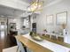 Dining room view into kitchen with pendant lighting and stainless steel appliances at 2769 Rivertowne Pkwy, Mount Pleasant, SC 29466
