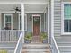 Charming front porch with welcoming decor and a cozy seating area at 2769 Rivertowne Pkwy, Mount Pleasant, SC 29466
