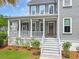 Charming front porch with a welcoming entryway and lush landscaping at 2769 Rivertowne Pkwy, Mount Pleasant, SC 29466