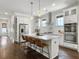 Bright kitchen features white cabinets, stainless steel appliances, marble countertops, and a spacious island at 2769 Rivertowne Pkwy, Mount Pleasant, SC 29466